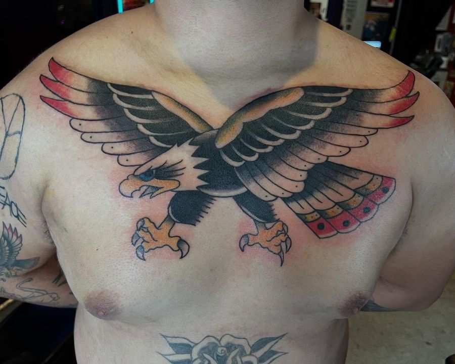American traditional eagle chest tattoo in bold color, tattooed by Josue