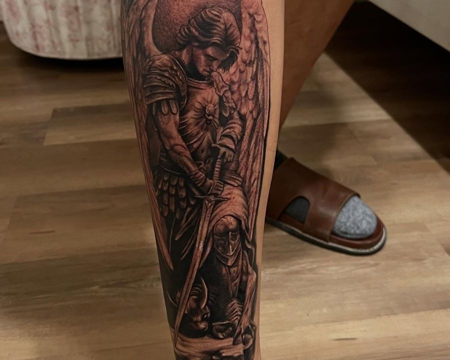 Archangel Michael calf piece in statuary black and grey, tattooed by Josue