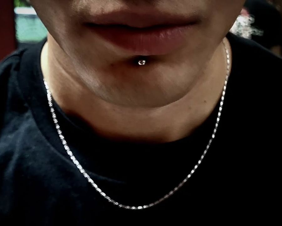 Labret piercing with a silver stud from the American Ink piercing studio