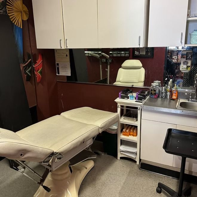 Clean, single-use station with a reclining chair set up for a session